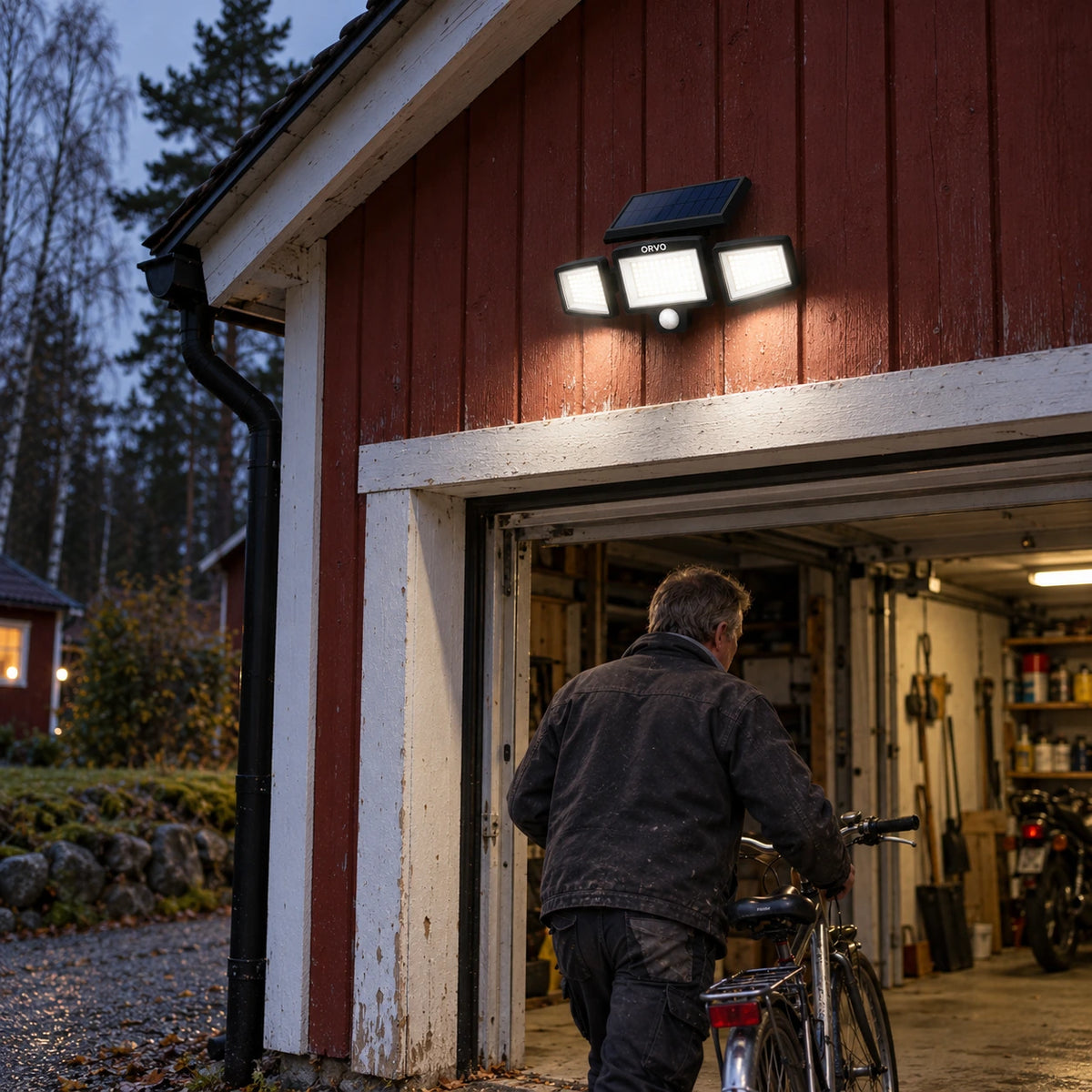 Orvo solar light lighting up a carport and driveway on a rainy evening